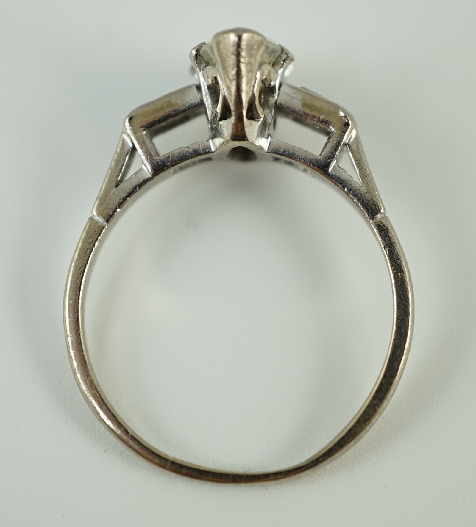 An 18ct white gold and single stone marquise cut diamond set ring, with baguette cut diamond set shoulders